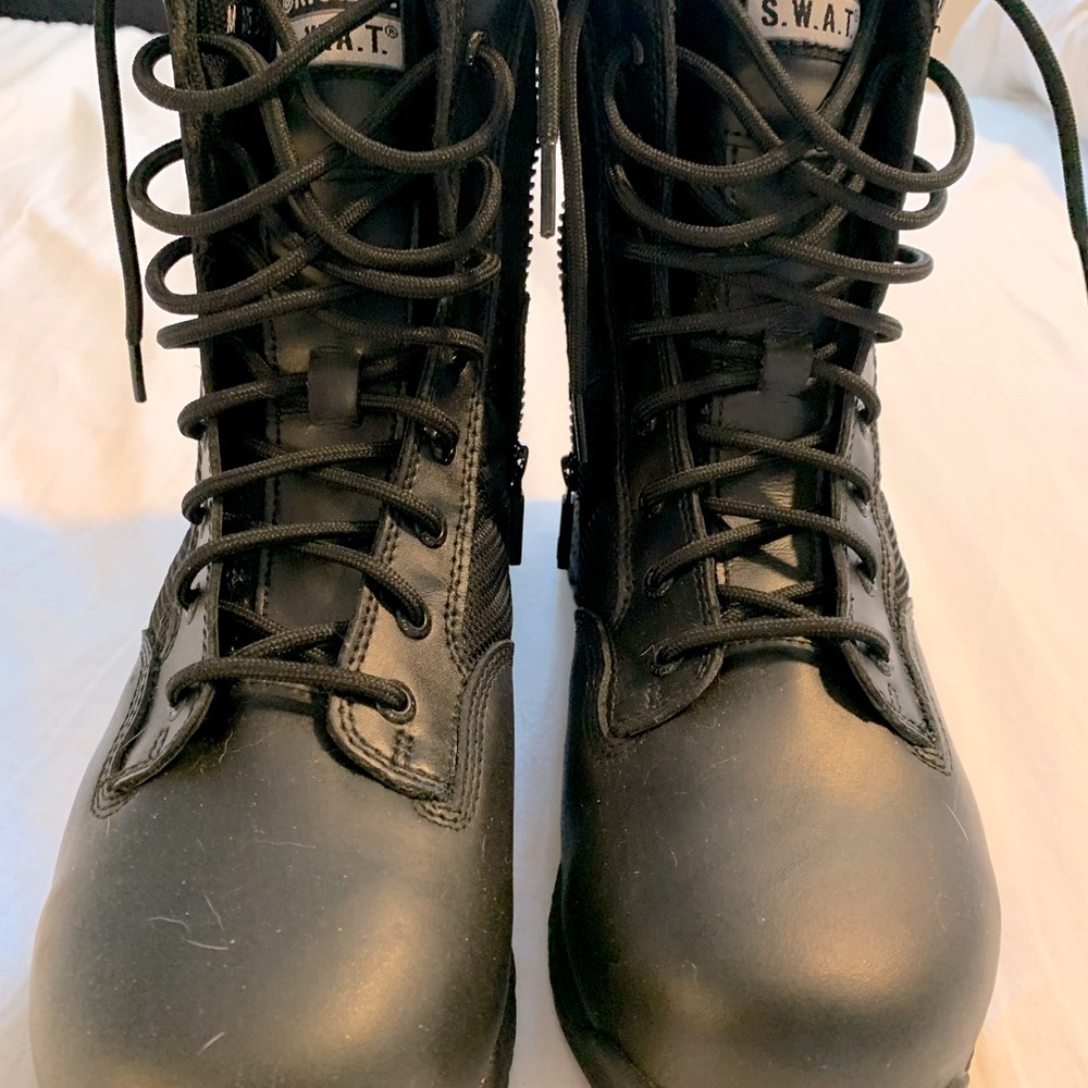 SWAT brand black steel toed work boots.